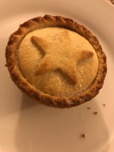 A photo of a mince pie with a pastry star on top