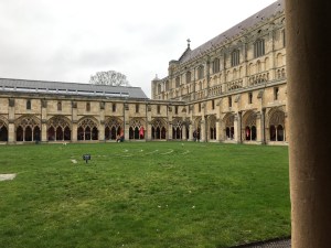 Looking through an archway at the grounds of the Cathedral and the cloisters