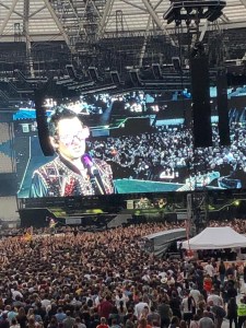 Photo close up of a screen showing Matt Bellamy’s light up jacket and flashing glasses
