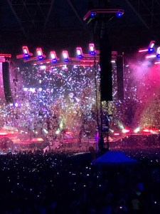 Confetti is showering the stage and audience. 