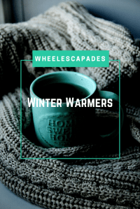 An image to pin. The title text ‘Winter Warmers’ is placed over a blue mug of tea and a great wooden blanket.