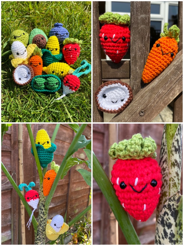 There are four images. One is of all the veg in a pile on the grass. One is a close up of the strawberry. One there are three characters on the fence. And one they are propped between branches in a tree.