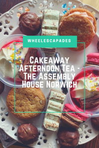 An image to pin. Title text Cakeaway Afternoon Tea - The Assembly House Norwich is place over the centre of a photo. The photo is taken looking down onto the top tier of cakes. 